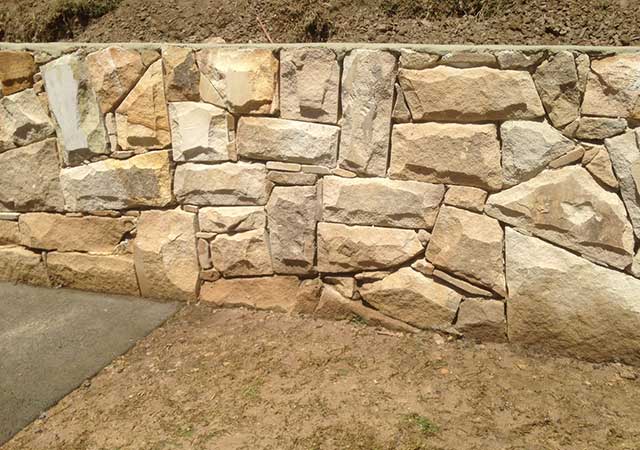Dry packed stone wall